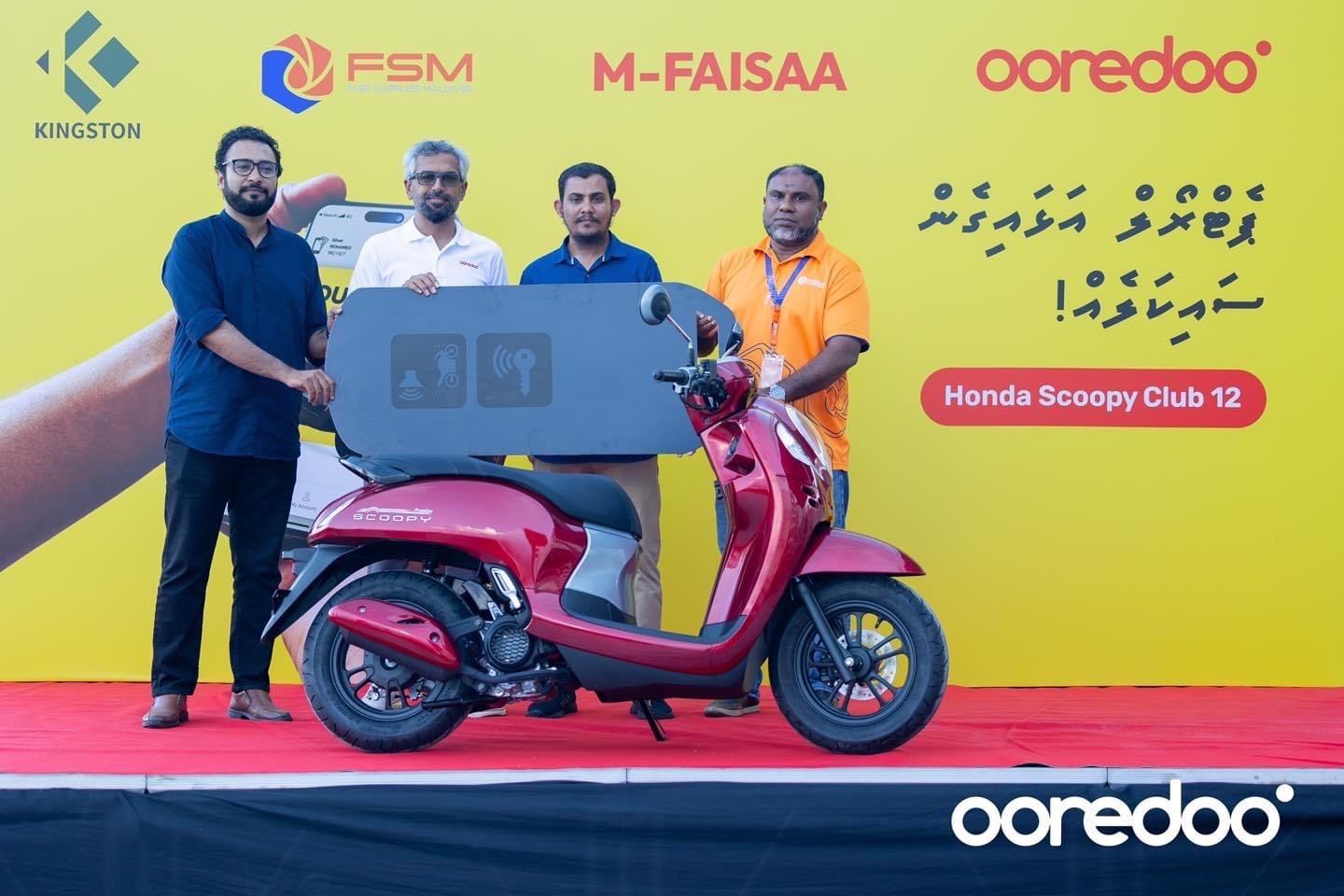 Ooredoo Maldives Presents Scoopy Motorbike to m-Faisaa FSM Promotion Lucky Winner
